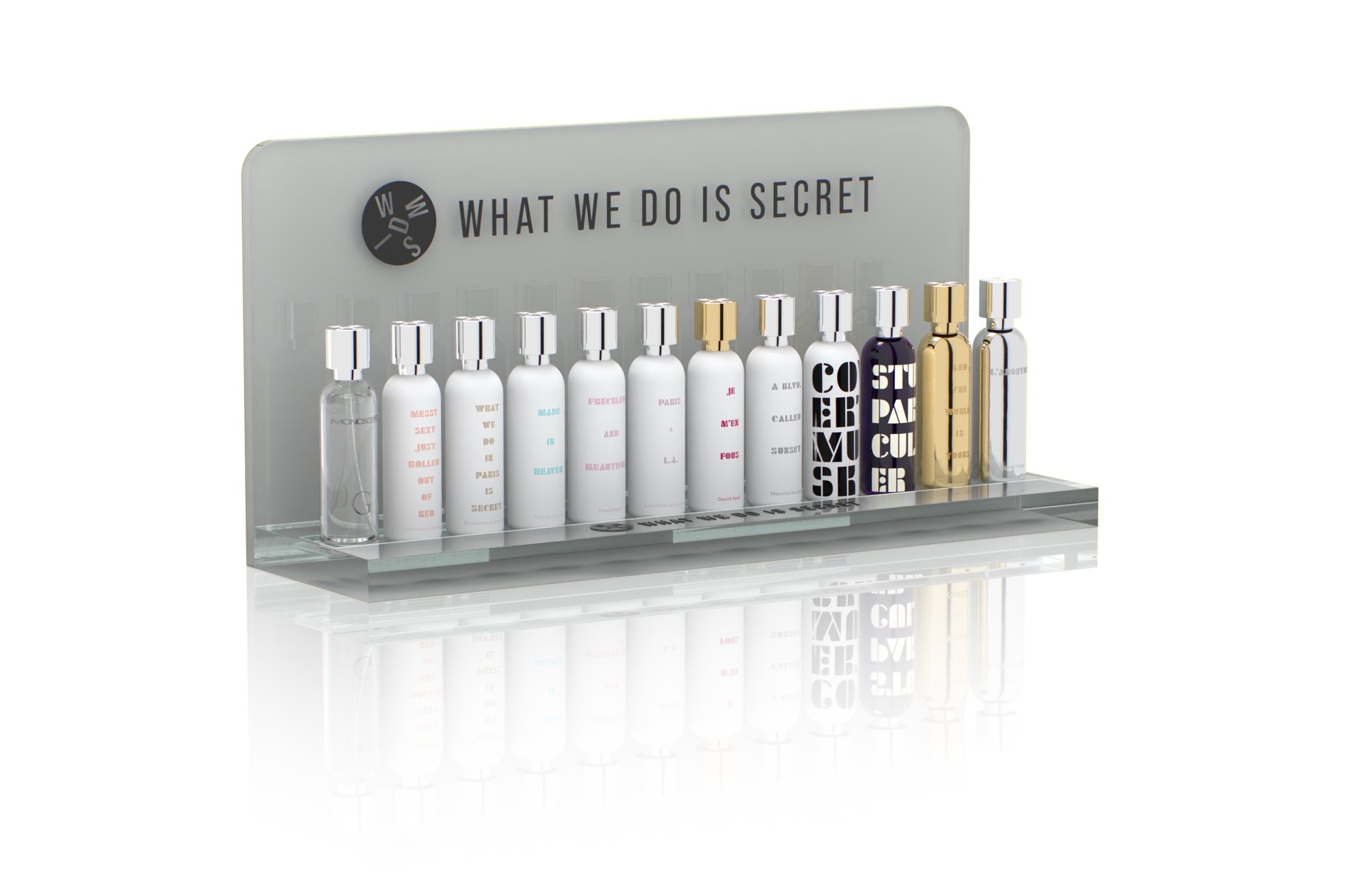 The What We Do Is Secret counter display with all twelve fragrances
